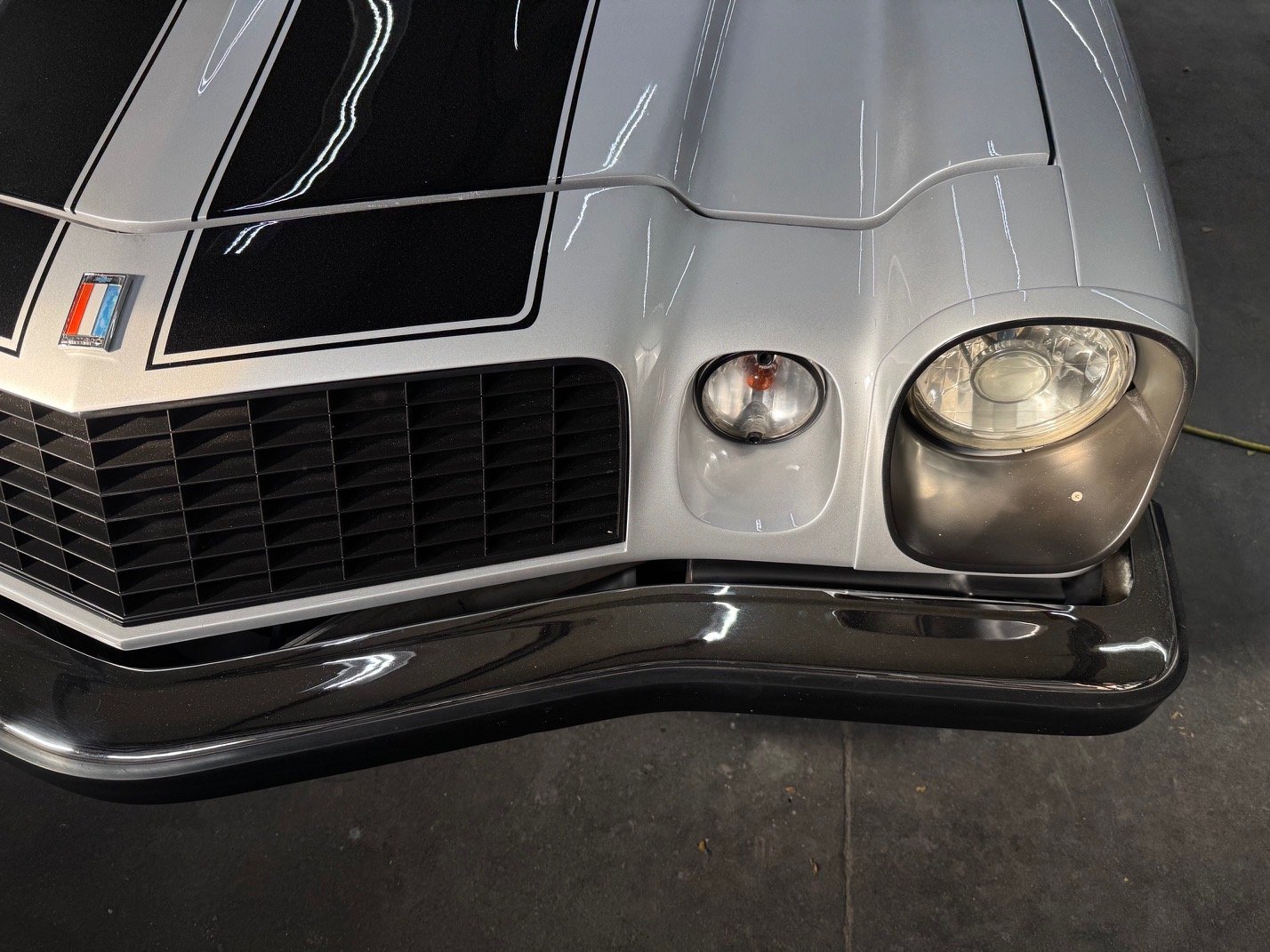 a white car is parked in a garage